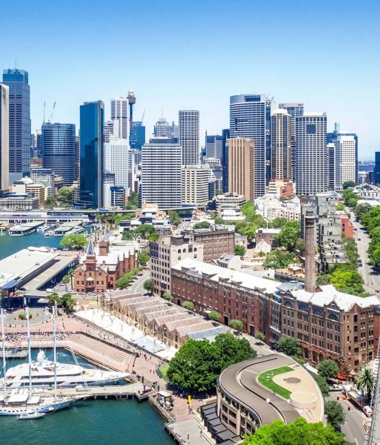 View overlooking The Rocks and Circular Quay towards the Sydney CBD skyline with traffic on Cahill Expressway.